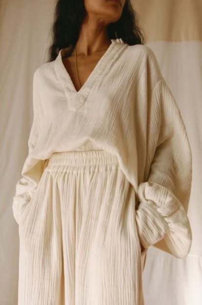 Photo of a woman wearing simple and elegant attire.